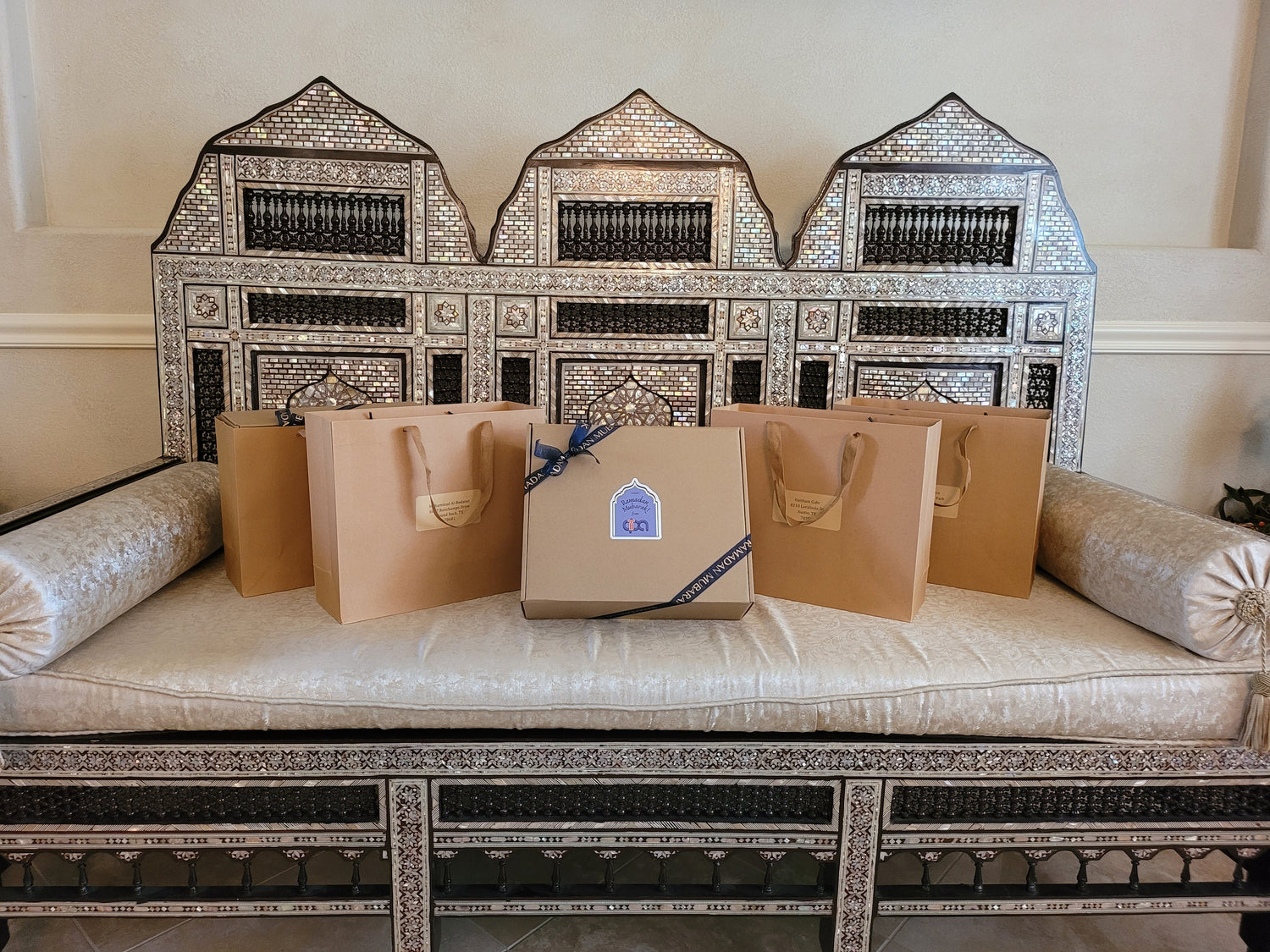 A gift box with a gold ribbon