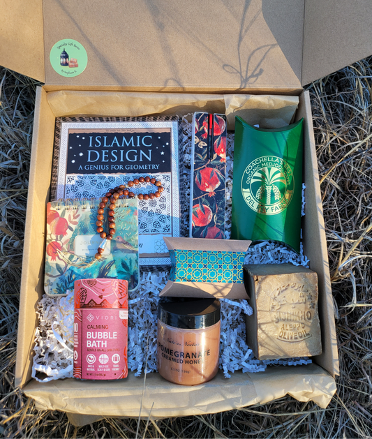 Box containing various items including a book titled 'Islamic Design' and dates.